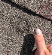 roof shingle needing hail damage repairs