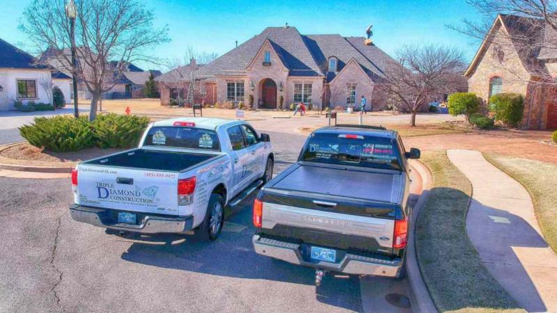 Roofing company performing spring roof inspection on residential home