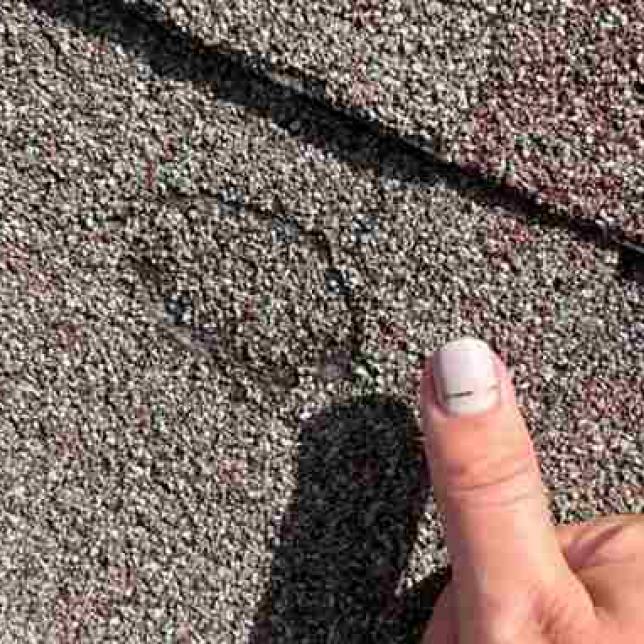roof shingle needing hail damage repairs